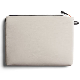 Bellroy Lite Laptop Sleeve 14" in beige fabric with minimalist design, zipper closure, and eco-friendly material