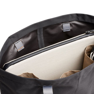 Bellroy Lite Laptop Sleeve 14 inside a black fabric bag showing interior compartments and lining details