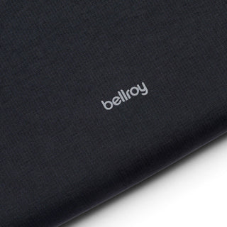 Bellroy Lite Laptop Sleeve 14 black fabric close-up with subtle brand logo detail visible