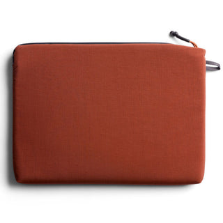 Bellroy Lite Laptop Sleeve 14" in rust fabric with subtle texture and zipper closure on top edge