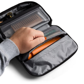 Bellroy Hanging Toiletry Kit showing water-resistant interior and multiple mesh compartments with toiletries
