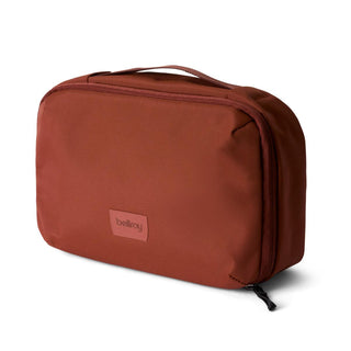 Bellroy Hanging Toiletry Kit in rust color with recycled fabric and minimalist design