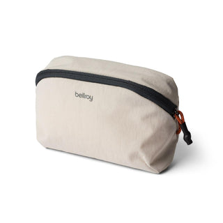 Bellroy Lite Packing Pouch 2L in light beige recycled fabric with black zipper and orange pull tab