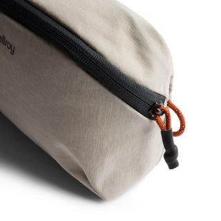 Bellroy Lite Packing Pouch 2L in beige recycled nylon with black zipper and orange pull tab detail