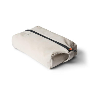 Bellroy Lite Packing Caddy 8L in light beige with black zipper and durable recycled fabric design
