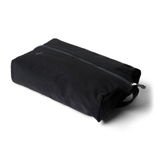 Bellroy Lite Packing Caddy 10L in black recycled fabric with top zipper and side handle detail