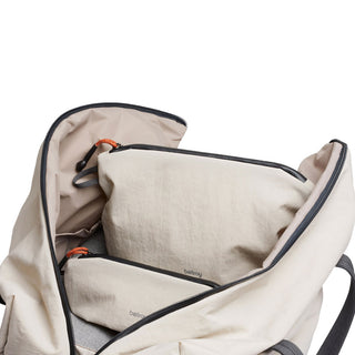 Bellroy Lite Pouch Duo in light beige recycled nylon, shown inside an open matching bag compartment.