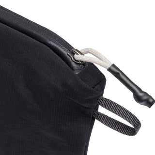 Bellroy Lite Pouch Duo close-up showing black recycled nylon fabric and zipper pull detail