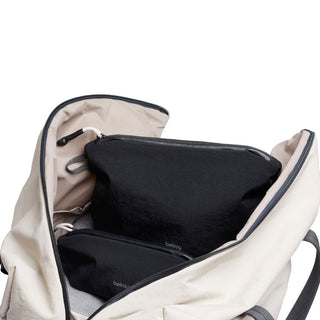 Bellroy Lite Pouch Duo with two black recycled nylon pouches inside a beige backpack opening