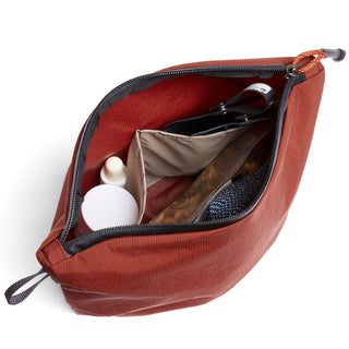 Bellroy Lite Pouch Duo in rust color showing organized interior compartments and textured recycled nylon material