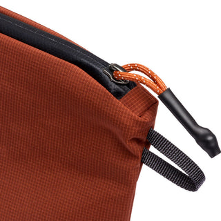 Bellroy Lite Pouch Duo in burnt orange with textured recycled nylon fabric and durable zipper pull detail