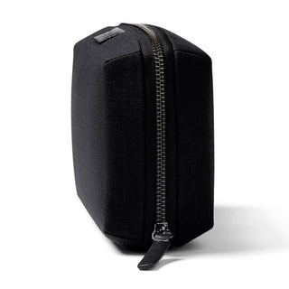 Bellroy Tech Kit black recycled fabric zippered pouch standing upright against white background