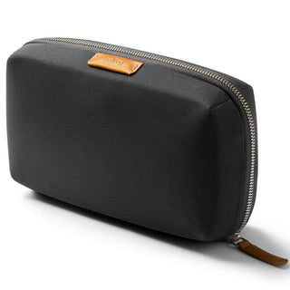 Bellroy Tech Kit in black recycled fabric with tan leather trim and sturdy zipper closure