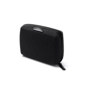 Bellroy Tech Kit Compact in black recycled fabric with zippered closure shown at slight angle