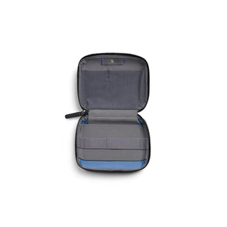 Bellroy Tech Kit Compact open showing internal elastic loops and recycled fabric lining in gray and blue