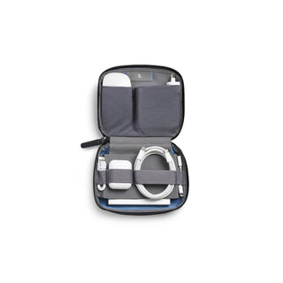 Bellroy Tech Kit Compact open showing organized compartments with charging cables and accessories inside