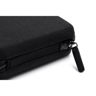 Bellroy Tech Kit Compact close-up showing black recycled fabric texture and zipper pull detail
