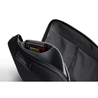 Bellroy Tech Kit Compact with organized compartments and durable recycled fabric in dark gray color
