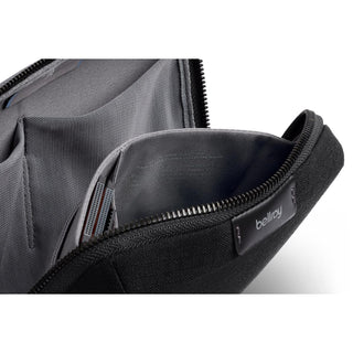 Bellroy Tech Kit Compact in black with smooth zipper and textured recycled fabric interior compartments