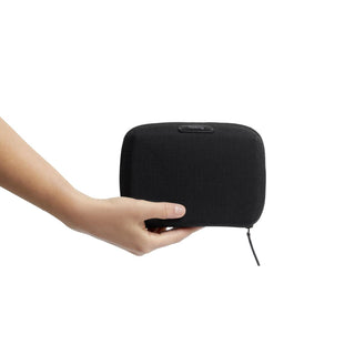 Bellroy Tech Kit Compact held in hand showing black recycled fabric and zipper closure