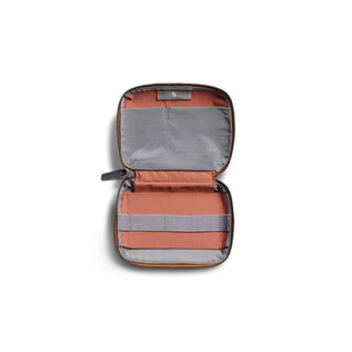 Bellroy Tech Kit Compact open showing organized compartments with gray and rust fabric interior