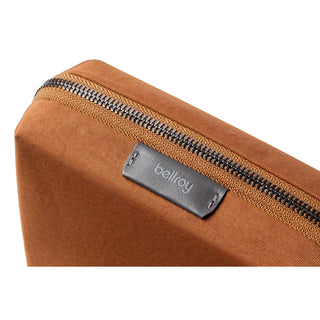 Bellroy Tech Kit Compact in brown recycled fabric with black Bellroy logo tag and silver zipper detail