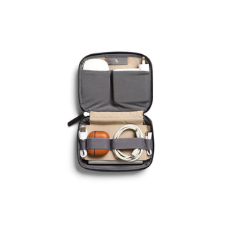 Bellroy Tech Kit Compact open showing organized compartments with cables and accessories inside