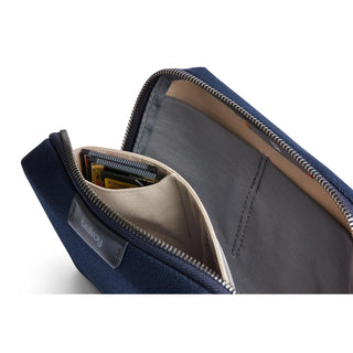 Bellroy Tech Kit Compact in navy blue showing organized interior card slots and durable recycled fabric lining