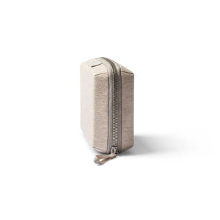 Bellroy Tech Kit Compact in beige recycled fabric showing side zipper and compact rectangular shape