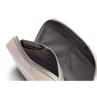 Bellroy Tech Kit Compact open showing internal compartments with grey recycled fabric lining