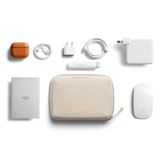 Bellroy Tech Kit Compact in beige recycled fabric with tech accessories neatly organized on white background