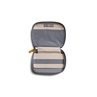 Bellroy Tech Kit Compact open flat showing grey recycled fabric interior with organizing straps and pockets