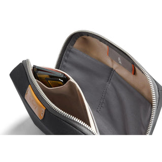 Bellroy Tech Kit Compact with organized interior pockets and durable recycled fabric in charcoal gray