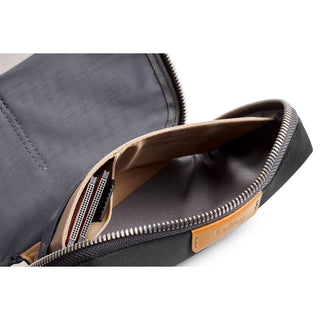 Bellroy Tech Kit Compact showing interior compartments with eco-friendly fabric and smooth zipper closure