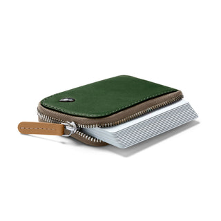 Bellroy Card Pocket in green leather with expandable accordion card slots and zipper closure detail
