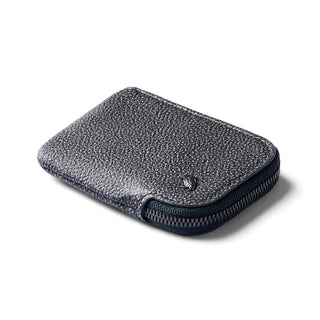 Bellroy Card Pocket in textured dark leather with zipper closure and compact rounded edges visible