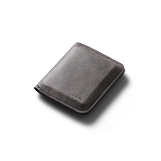 Bellroy Apex Note Sleeve in smooth dark leather showing compact folded design with subtle logo embossing