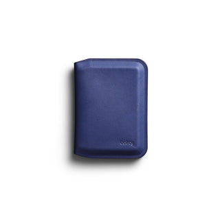 Bellroy Apex Slim Sleeve wallet in navy leather with smooth texture and compact design on white background