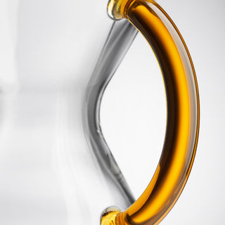 Close-up of the amber glass handle on the CHEMEX® Six Cup Glass Handle coffee maker vessel