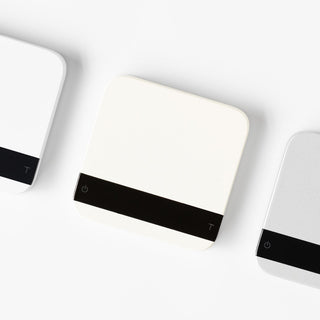 ACAIA Lunar Digital Scale in white with sleek black touch controls and minimalist compact design