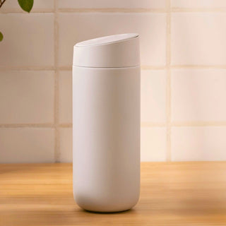 FELLOW Carter Slide Mug 16oz in matte white with smooth ceramic finish and angled slide lid design