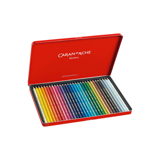 Caran d'Ache Supracolor Aquarelle Colour Pencil set in a red metal case with vibrant colors arranged neatly