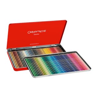 Caran d'Ache Supracolor Aquarelle Colour Pencil set in an open red metal tin displaying vibrant shades in hexagonal cedar wood barrels