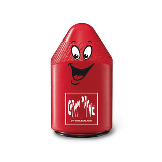 Caran d'Ache Double Pencil Sharpener in red plastic with playful face design and textured grip