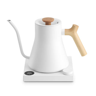 Fellow Stagg EKG Pro Electric Pour Over Kettle (120V) in white with wooden handle on base station