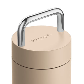 FELLOW Carter Carry Tumbler (20oz/591ml) beige lid with polished metal handle detail close-up view