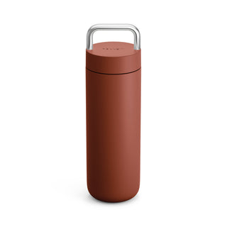 Fellow Carter Carry Tumbler (20oz/591ml) in matte terracotta with stainless steel handle and sleek finish