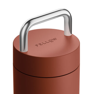 FELLOW Carter Carry Tumbler (20oz/591ml) rust color with stainless steel handle on lid close-up view