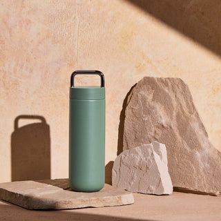 FELLOW Fellow Carter Carry Tumbler (20oz/591ml) in matte green with stainless steel handle and ceramic coating