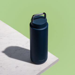 Fellow Carter Carry Tumbler (32oz/946ml) in navy blue with stainless steel handle and matte finish